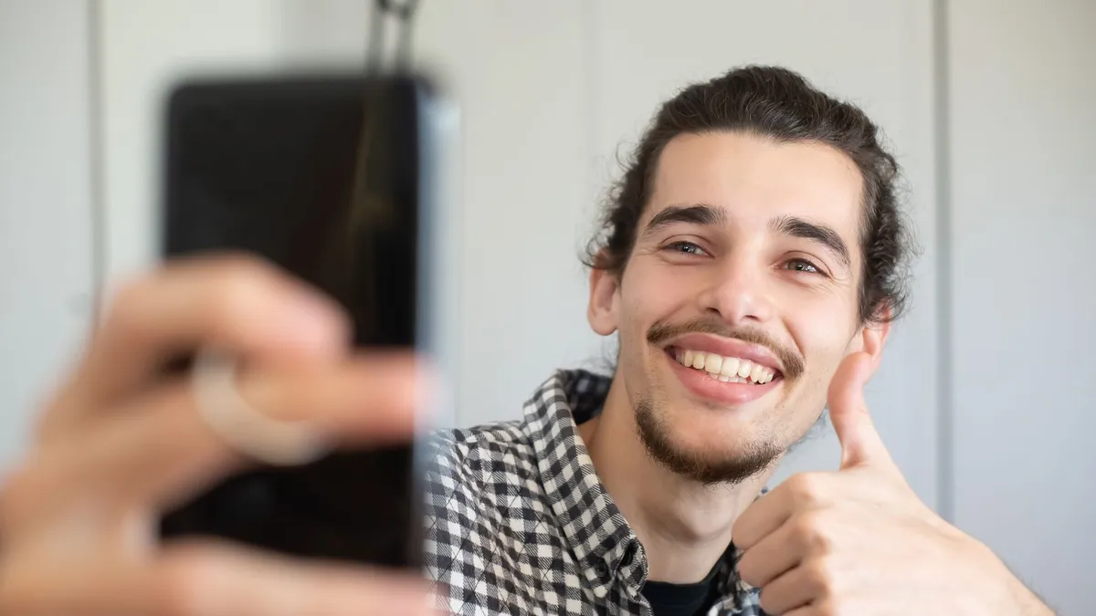 Couple sharing good news at a laptop after their payday loan is approved and funded the same day