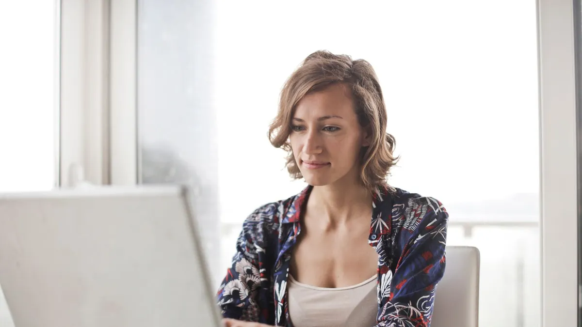 Person signing a no refusal payday loans agreement on a tablet after reviewing the disclosed fee