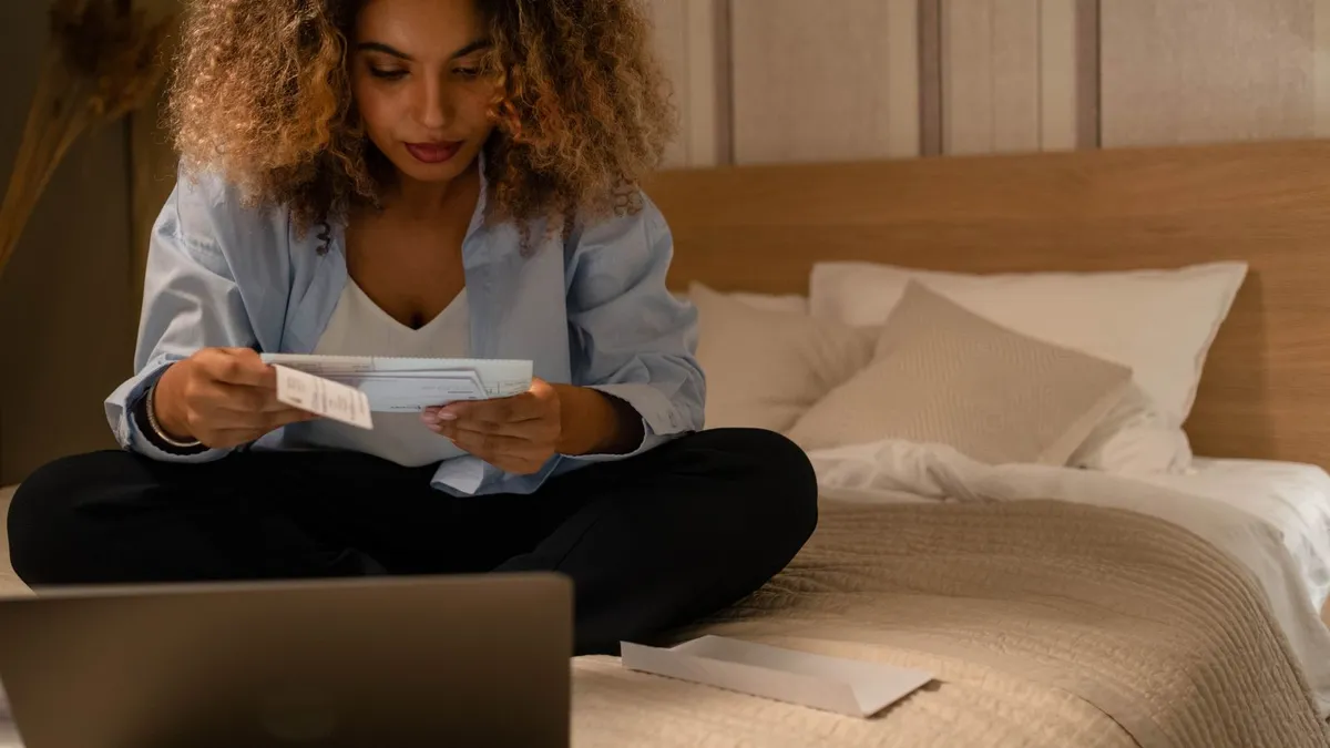 Person at home reviewing a benefit deposit letter before applying for a payday loan while unemployed